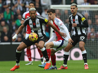 Newcastle United's Joelinton is in action with Arsenal's Kai Havertz during the Premier League match between Newcastle United and Arsenal at...