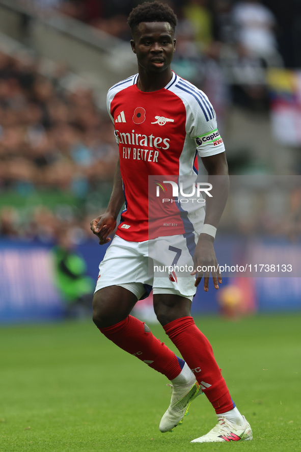 Bukayo Saka plays during the Premier League match between Newcastle United and Arsenal at St. James's Park in Newcastle, United Kingdom, on...