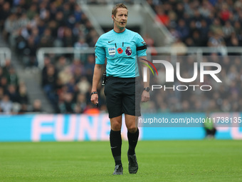 Match referee John Brooks officiates during the Premier League match between Newcastle United and Arsenal at St. James's Park in Newcastle,...