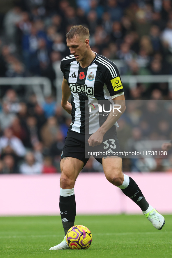 Dan Burn of Newcastle United plays during the Premier League match between Newcastle United and Arsenal at St. James's Park in Newcastle, Un...