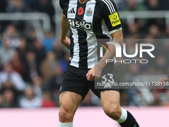 Dan Burn of Newcastle United plays during the Premier League match between Newcastle United and Arsenal at St. James's Park in Newcastle, Un...