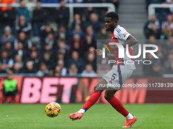 Thomas Partey plays during the Premier League match between Newcastle United and Arsenal at St. James's Park in Newcastle, United Kingdom, o...