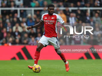 Thomas Partey plays during the Premier League match between Newcastle United and Arsenal at St. James's Park in Newcastle, United Kingdom, o...