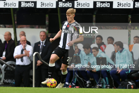 Lewis Hall of Newcastle United plays during the Premier League match between Newcastle United and Arsenal at St. James's Park in Newcastle,...