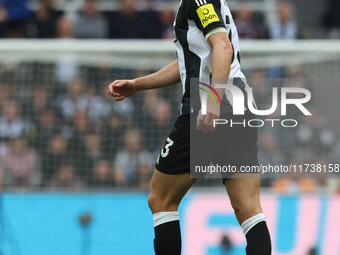 Dan Burn of Newcastle United participates in the Premier League match between Newcastle United and Arsenal at St. James's Park in Newcastle,...