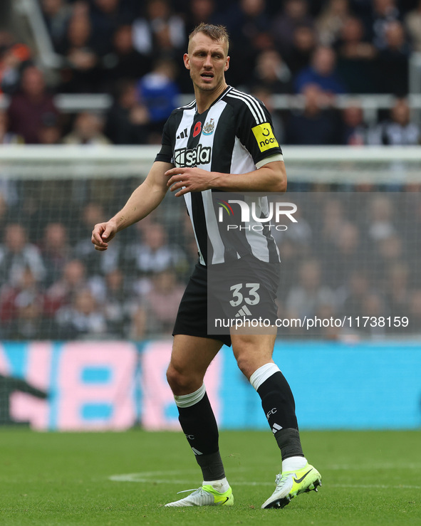 Dan Burn of Newcastle United participates in the Premier League match between Newcastle United and Arsenal at St. James's Park in Newcastle,...