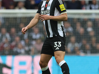 Dan Burn of Newcastle United participates in the Premier League match between Newcastle United and Arsenal at St. James's Park in Newcastle,...