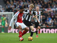 Arsenal's Gabriel dispossesses Newcastle United's Anthony Gordon during the Premier League match between Newcastle United and Arsenal at St....