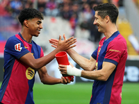 Lamine Yamal gives Robert Lewandowski the MVP of the month of October EA Sports LaLiga award before the match between FC Barcelona and RCD E...