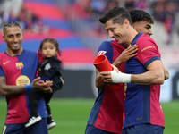 Lamine Yamal gives Robert Lewandowski the MVP of the month of October EA Sports LaLiga award before the match between FC Barcelona and RCD E...