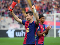 Robert Lewandowski holds the MVP trophy for the month of October before the match between FC Barcelona and RCD Espanyol, corresponding to we...