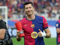 Robert Lewandowski holds the MVP trophy for the month of October before the match between FC Barcelona and RCD Espanyol, corresponding to we...