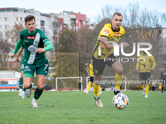 Tomasz Kaczmarek and Pawel Lysiak participate in the game between Wieczysta Krakow and Olimpia Grudziadz in Krakow, Poland, on November 3, 2...