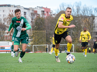 Tomasz Kaczmarek and Pawel Lysiak participate in the game between Wieczysta Krakow and Olimpia Grudziadz in Krakow, Poland, on November 3, 2...