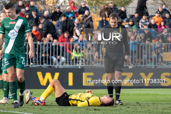 Referee Piotr Szypula officiates the game between Wieczysta Krakow and Olimpia Grudziadz in Krakow, Poland, on November 3, 2024, during the...