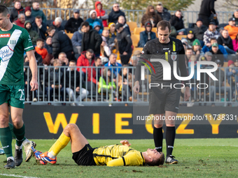 Referee Piotr Szypula officiates the game between Wieczysta Krakow and Olimpia Grudziadz in Krakow, Poland, on November 3, 2024, during the...