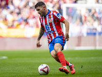 Javi Galan of Atletico de Madrid is in action with the ball during the La Liga EA Sports 2024/25 football match between Atletico de Madrid a...