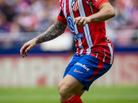 Javi Galan of Atletico de Madrid is in action with the ball during the La Liga EA Sports 2024/25 football match between Atletico de Madrid a...