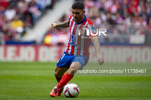 Javi Galan of Atletico de Madrid is in action with the ball during the La Liga EA Sports 2024/25 football match between Atletico de Madrid a...