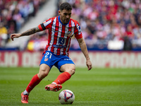 Javi Galan of Atletico de Madrid is in action with the ball during the La Liga EA Sports 2024/25 football match between Atletico de Madrid a...