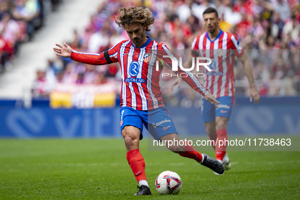 Antoine Griezmann of Atletico de Madrid is in action with the ball during the La Liga EA Sports 2024/25 football match between Atletico de M...