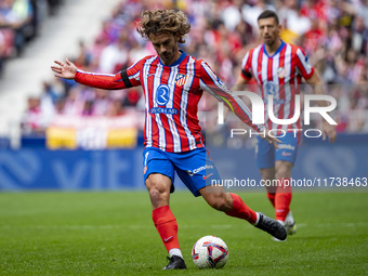 Antoine Griezmann of Atletico de Madrid is in action with the ball during the La Liga EA Sports 2024/25 football match between Atletico de M...