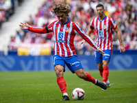 Antoine Griezmann of Atletico de Madrid is in action with the ball during the La Liga EA Sports 2024/25 football match between Atletico de M...