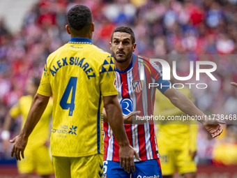 Jorge Resurreccion Merodio (Koke) of Atletico de Madrid (R) argues with Alex Suarez of UD Las Palmas (L) during the La Liga EA Sports 2024/2...