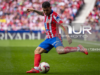 Javi Galan of Atletico de Madrid is in action with the ball during the La Liga EA Sports 2024/25 football match between Atletico de Madrid a...