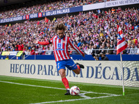 Antoine Griezmann of Atletico de Madrid takes a corner kick during the La Liga EA Sports 2024/25 football match between Atletico de Madrid a...