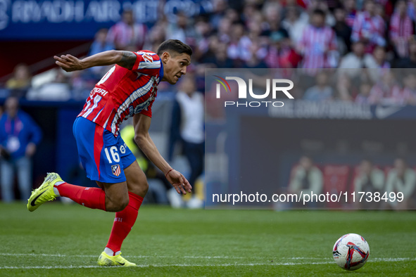 Nahuel Molina of Atletico de Madrid runs with the ball during the La Liga EA Sports 2024/25 football match between Atletico de Madrid and UD...