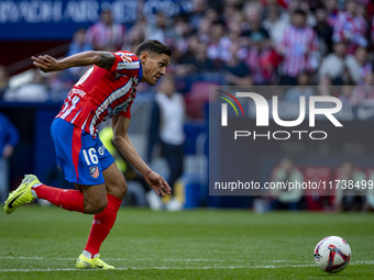 Nahuel Molina of Atletico de Madrid runs with the ball during the La Liga EA Sports 2024/25 football match between Atletico de Madrid and UD...