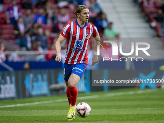 Conor Gallagher of Atletico de Madrid is in action with the ball during the La Liga EA Sports 2024/25 football match between Atletico de Mad...