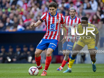 Julian Alvarez of Atletico de Madrid is in action with the ball during the La Liga EA Sports 2024/25 football match between Atletico de Madr...