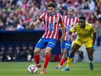 Julian Alvarez of Atletico de Madrid is in action with the ball during the La Liga EA Sports 2024/25 football match between Atletico de Madr...