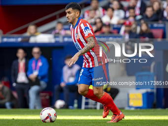 Angel Correa of Atletico de Madrid is in action with the ball during the La Liga EA Sports 2024/25 football match between Atletico de Madrid...