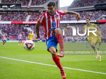 Angel Correa of Atletico de Madrid is in action with the ball during the La Liga EA Sports 2024/25 football match between Atletico de Madrid...