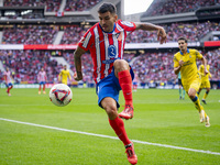 Angel Correa of Atletico de Madrid is in action with the ball during the La Liga EA Sports 2024/25 football match between Atletico de Madrid...