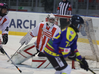 A hockey match between KS Cracovia 1906 (reds) and MMKS Podhale Nowy Targ (blues) takes place at the Adam 'Roch' Kowalski ice rink on the oc...