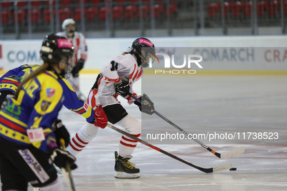 A hockey match between KS Cracovia 1906 (reds) and MMKS Podhale Nowy Targ (blues) takes place at the Adam 'Roch' Kowalski ice rink on the oc...