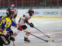 A hockey match between KS Cracovia 1906 (reds) and MMKS Podhale Nowy Targ (blues) takes place at the Adam 'Roch' Kowalski ice rink on the oc...