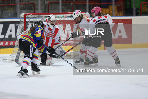 A hockey match between KS Cracovia 1906 (reds) and MMKS Podhale Nowy Targ (blues) takes place at the Adam 'Roch' Kowalski ice rink on the oc...