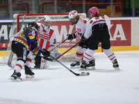 A hockey match between KS Cracovia 1906 (reds) and MMKS Podhale Nowy Targ (blues) takes place at the Adam 'Roch' Kowalski ice rink on the oc...