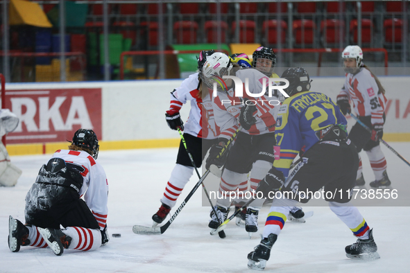 A hockey match between KS Cracovia 1906 (reds) and MMKS Podhale Nowy Targ (blues) takes place at the Adam 'Roch' Kowalski ice rink on the oc...