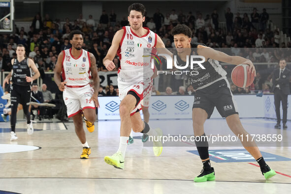 Quinn Ellis of Dolomiti Energia Trentino contrasts with Leandro Bolmaro of EA7 Emporio Armani Milano during the match between Dolomiti Energ...