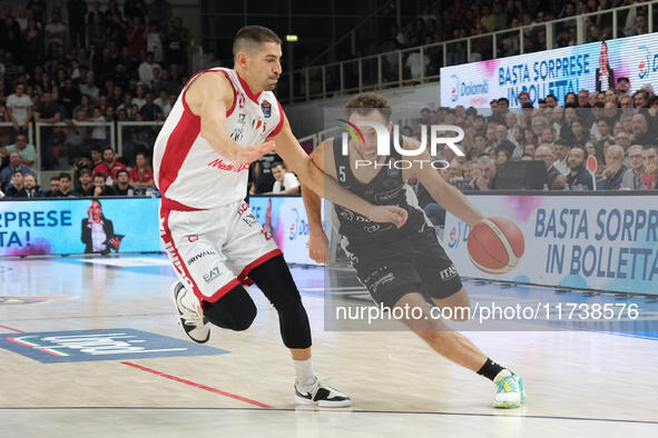 Jordan Ford of Dolomiti Energia Trentino contrasts with Diego Flaccadori of EA7 Emporio Armani Milano during the match between Dolomiti Ener...