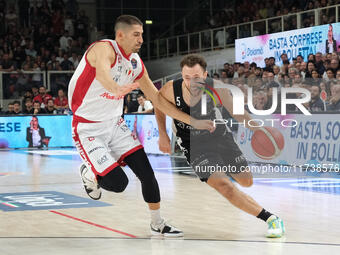 Jordan Ford of Dolomiti Energia Trentino contrasts with Diego Flaccadori of EA7 Emporio Armani Milano during the match between Dolomiti Ener...