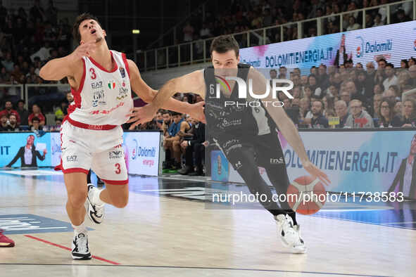 Andrea Pecchia of Dolomiti Energia Trentino is followed by Giordano Bortolani of EA7 Emporio Armani Milano during the match between Dolomiti...