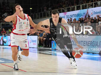 Andrea Pecchia of Dolomiti Energia Trentino is followed by Giordano Bortolani of EA7 Emporio Armani Milano during the match between Dolomiti...