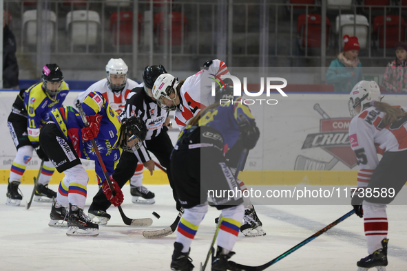 A hockey match between KS Cracovia 1906 (reds) and MMKS Podhale Nowy Targ (blues) takes place at the Adam 'Roch' Kowalski ice rink on the oc...